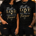 Couple wearing Built on Love Focused on Forever unisex black T-shirts with natural straight hems